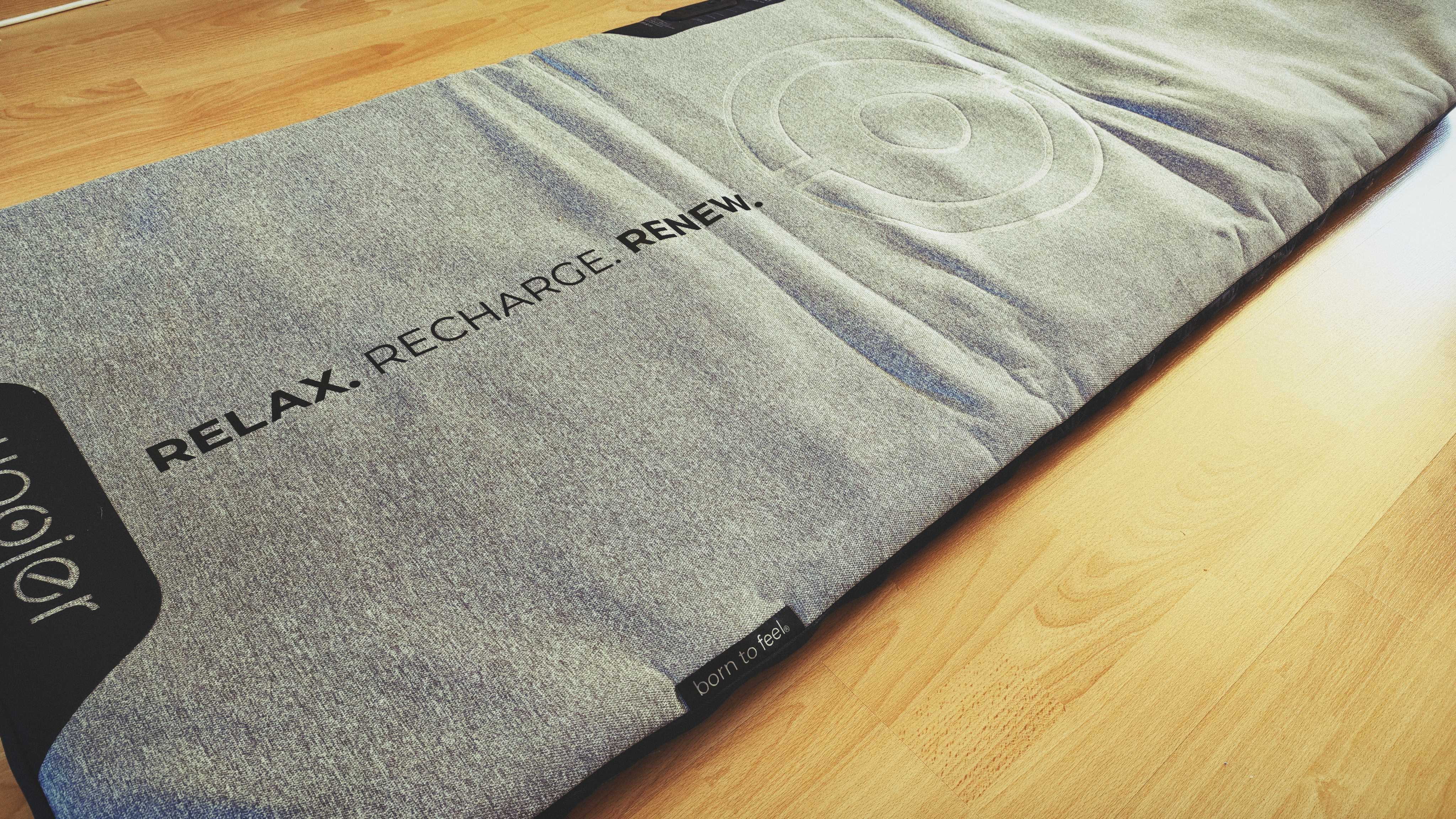 A Woojer Mat on a wooden floor