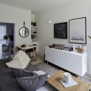 living area with sofa and dining area