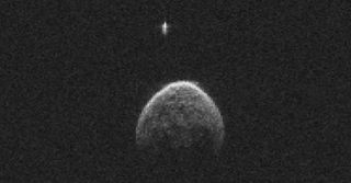 Radar image showing the near-Earth asteroid 2004 BL86 and its moon flying past Earth on Jan. 26, 2015.