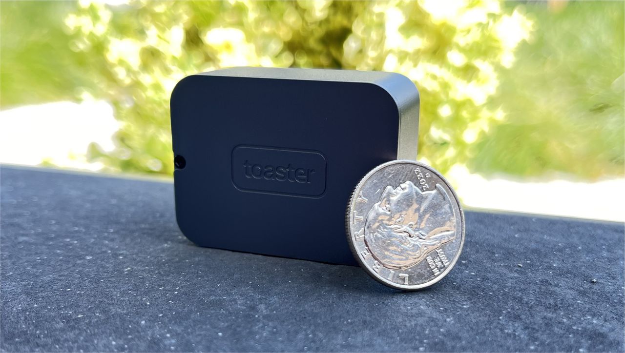 Toaster Photon camera next to coin