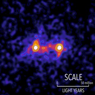 Dark matter filaments bridge the space between galaxies in this false color map. The locations of bright galaxies are shown by the white regions and the presence of a dark matter filament bridging the galaxies is shown in red.