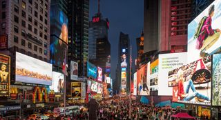 The best digital marketing campaigns capture attention: Times Square with digital advertising billboards at dusk 
