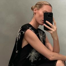 Elly McGaw wearing a sheer silk Prada dress with embellishments in the Prada dressing room.