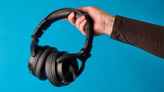OneOdio Studio Max 2 in black photographed in front of a blue background