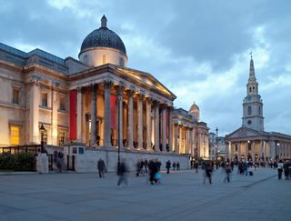 The National Gallery and the church St. Martin's in the Fields at dusk. Trafalgar Square, London, UK