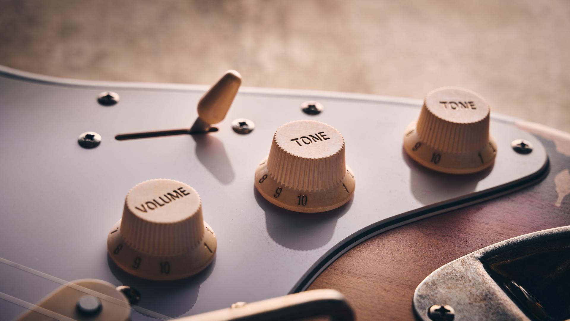 Close up of the volume and tone knobs with pickup selector on the Harley Benton ST-62HA electric guitar