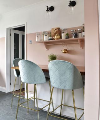 soft pink kitchen with blue velvet bar stools