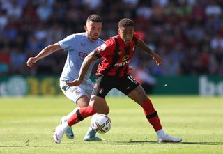 Marcus Tavernier of AFC Bournemouth is challenged by John McGinn of Aston Villa during the Premier League match between AFC Bournemouth and Aston Villa at Vitality Stadium on August 06, 2022 in Bournemouth, England.