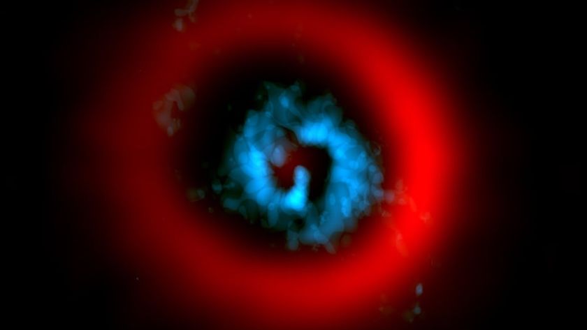 An image of a blue swirl with a red halo around it in outer space
