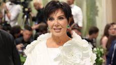 Close up of Kris Jenner in a white dress
