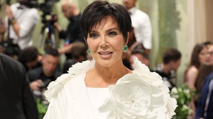 Close up of Kris Jenner in a white dress