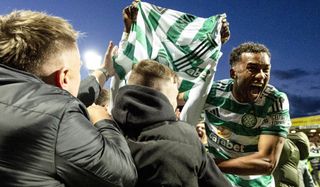 Celtic's Auston Trusty celebrates with fans after Kelechi Iheanacho scores a penalty to make it 3-2 during a William Hill Premiership match between Motherwell and Celtic at Fir Park