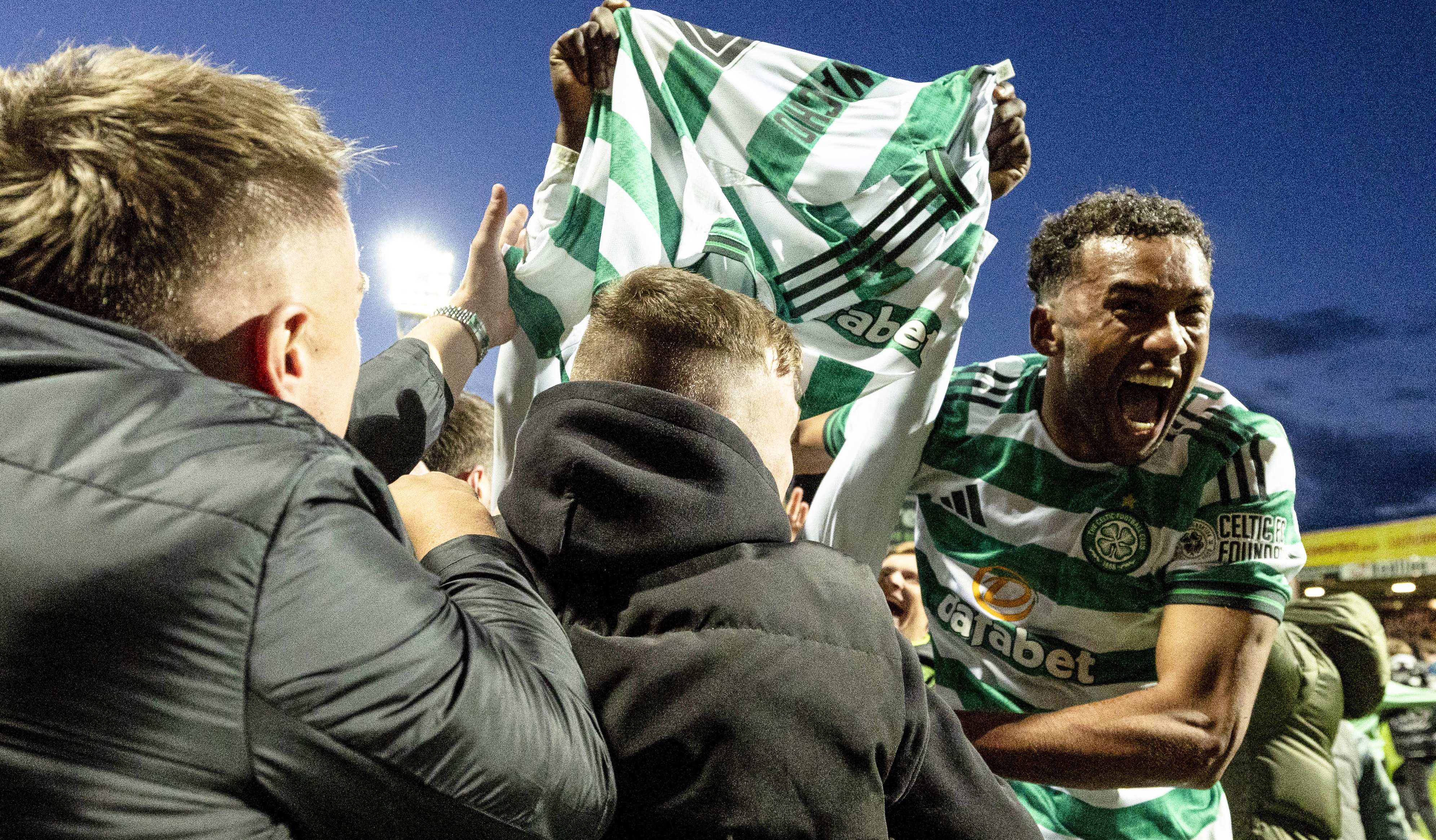 Celtic's Auston Trusty celebrates with fans after Kelechi Iheanacho scores a penalty to make it 3-2 during a William Hill Premiership match between Motherwell and Celtic at Fir Park