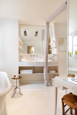 Rustic beige bathroom with beams