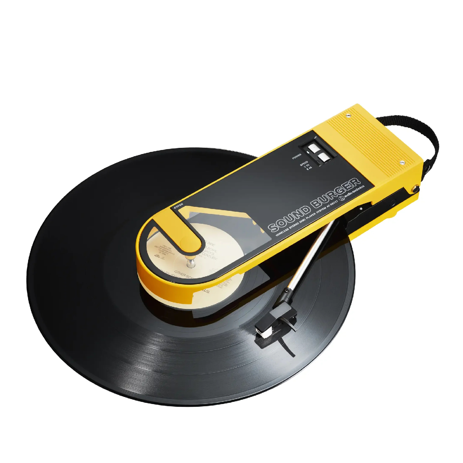 A yellow Audio-Technica Sound Burger portable turntable with a record inside. The background is plain white.