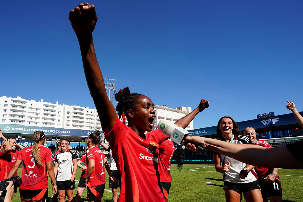 Melvine Malard with her arms in the air