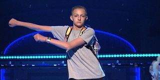 Backpack Kid performing floss dance