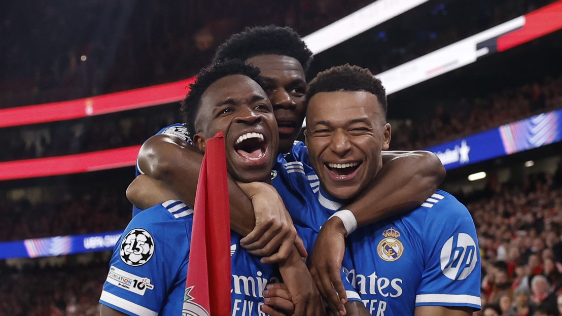 Vinicius Junior of Real Madrid celebrates with his teammates after scoring a goal during the UEFA Champions League 2025/26 League Knockout Play-off First Leg match between SL Benfica and Real Madrid C.F. at Estadio do SL Benfica on February 17, 2026 in Lisbon, Portugal. 