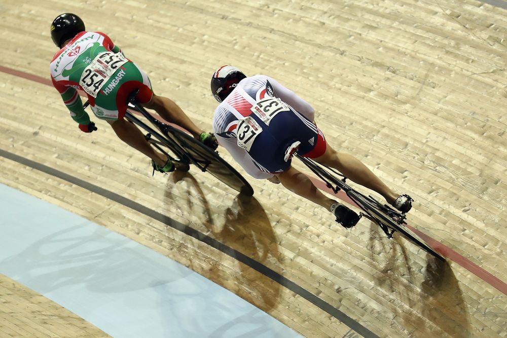 Joe Truman of Great Britain races against Sandor Szalontay of Hungary during the Men's Sprint