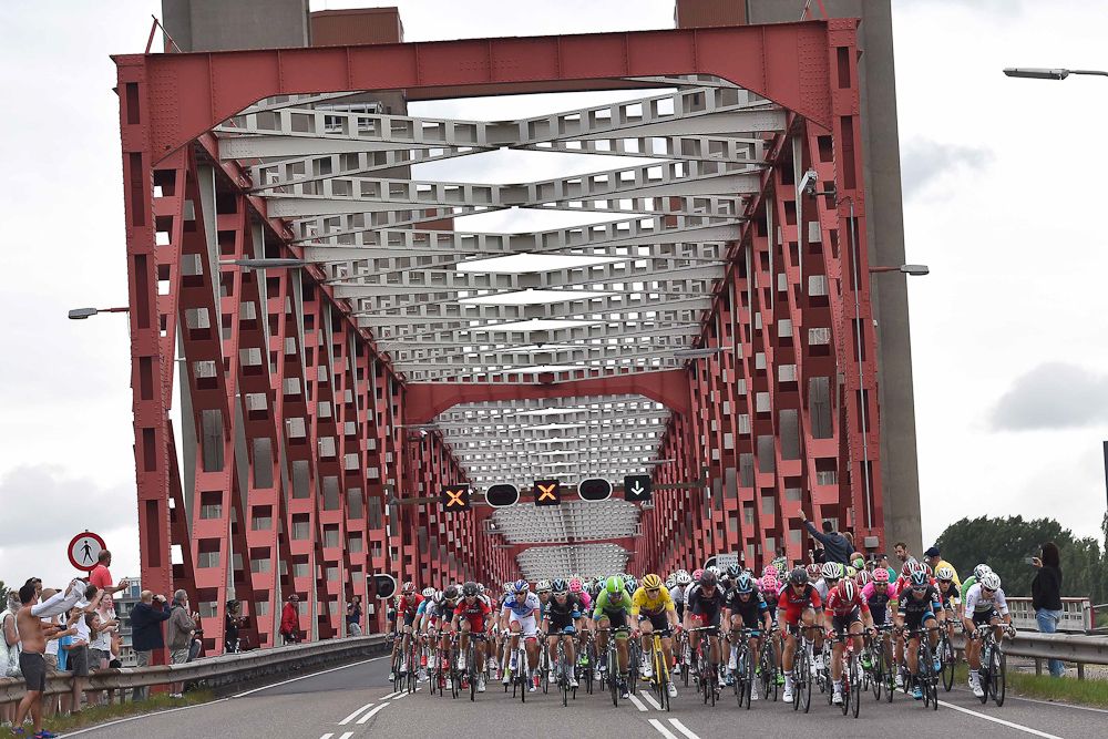 The peloton crosses a bridge during stage 2.