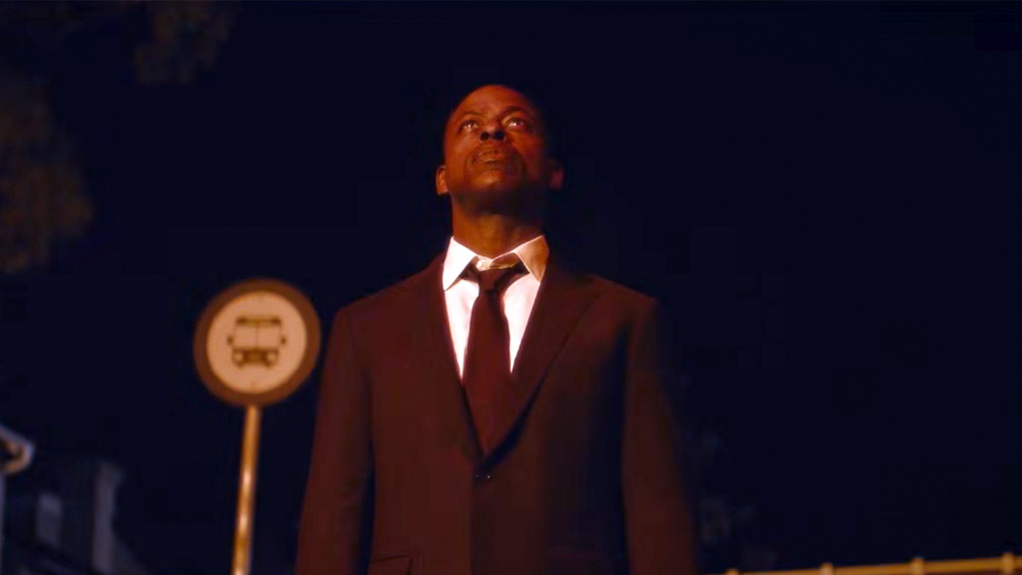 Sterling K. Brown in a dark suit with a dark background in Paradise