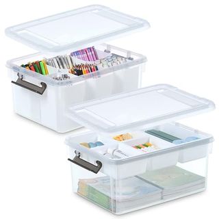 Two large plastic storage containers with clip lids, top layers sectioned off with dividers