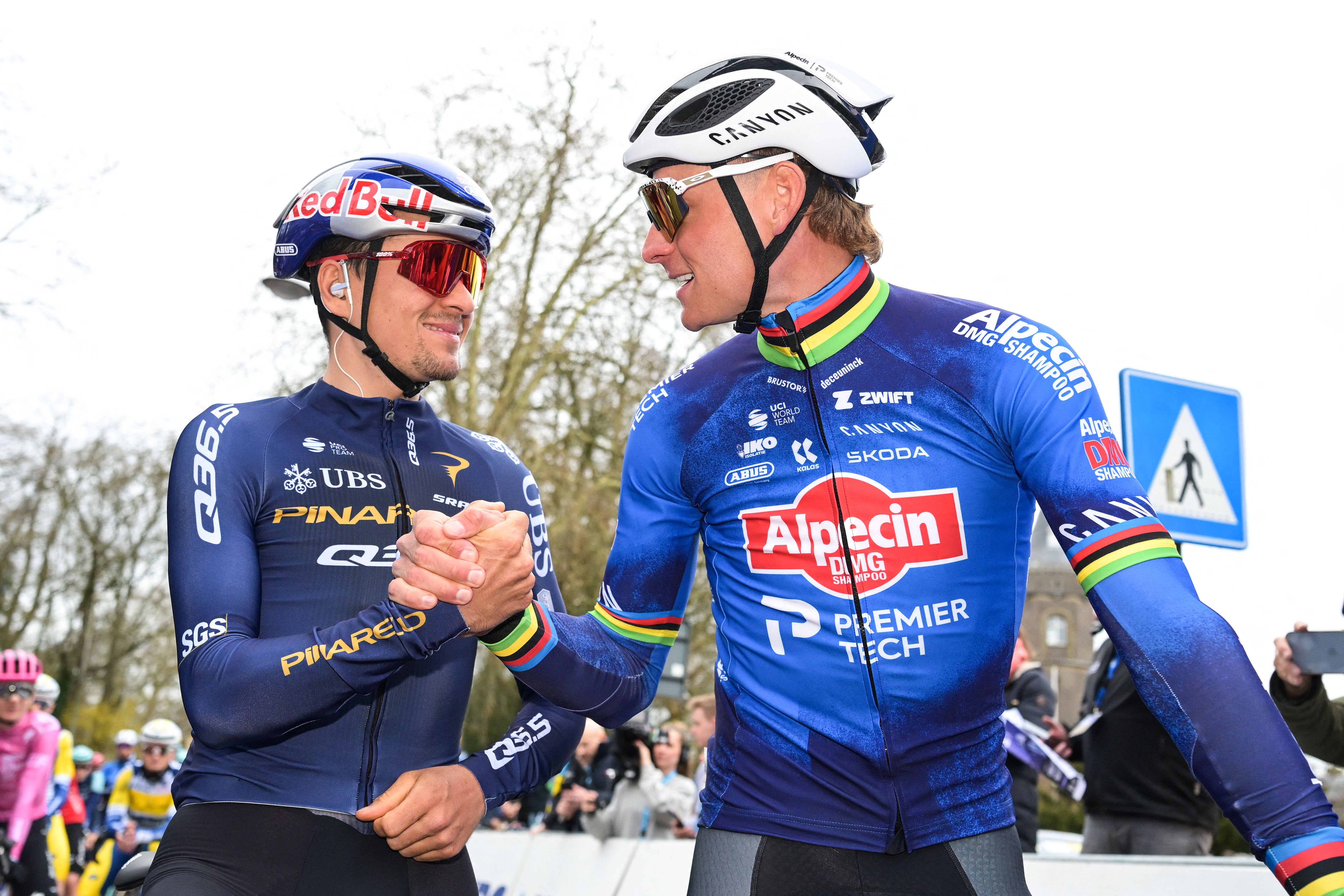 Tom Pidcock and Mathieu van der Poel shake hands at the 2026 Omloop Het Nieuwsblad