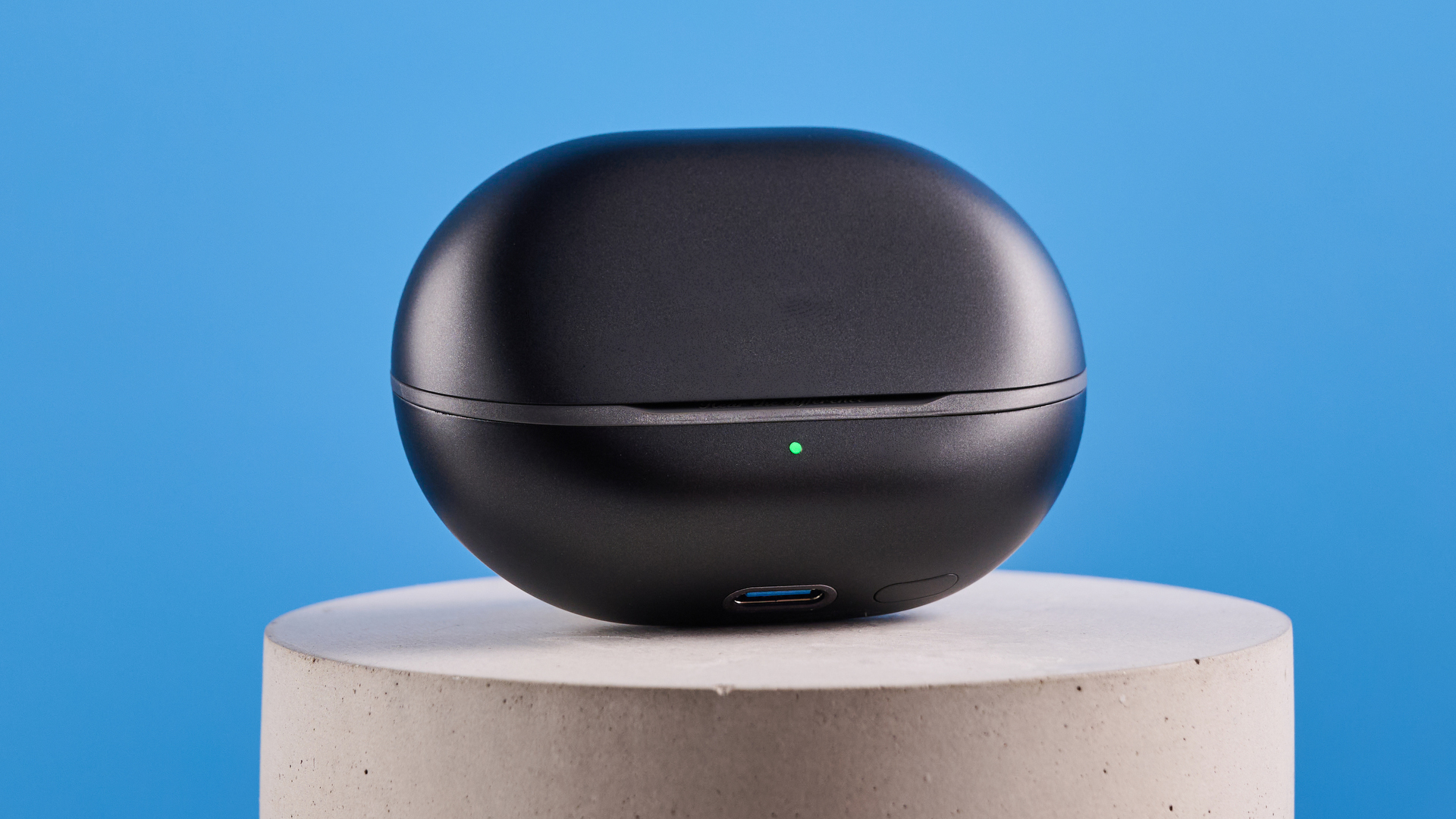 the soundpeats air5 pro earbuds in black and bronze with a black charging case and ear tips