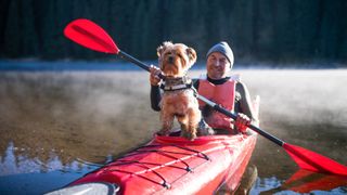 Man and dog kayaking