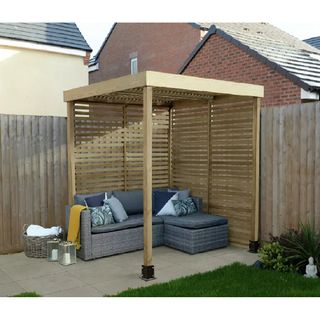 wooden pergola with slatted sides on patio