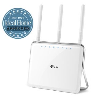 White TP-Link wireless router with Ideal Home Approved stamp