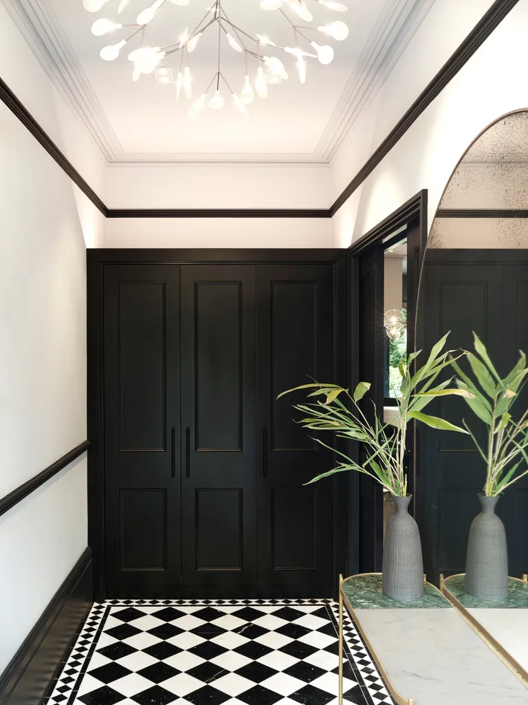 a small entryway with pocket doors