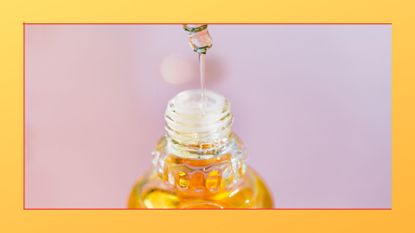 an orange liquid being dispensed out of a pipette on a purple background, with an orange border