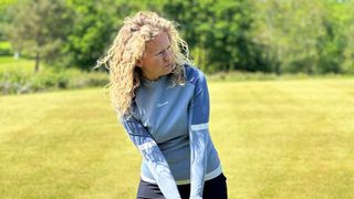 Macade Women’s TR Tour Mock Neck Top worn on the golf course
