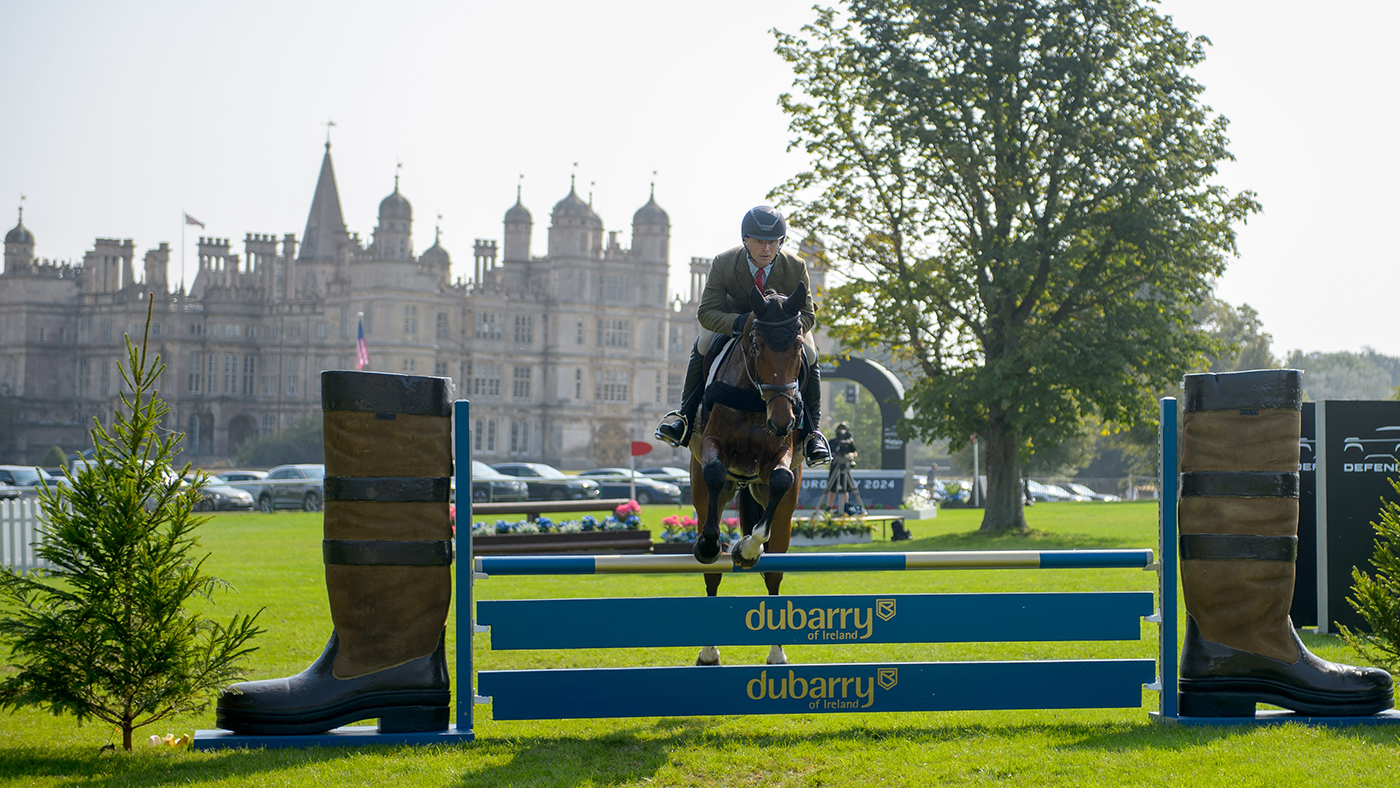 Mike Jackson and Oscar, jump the Dubarry planks on their way to winning the five-year-old Dubarry Burghley Young Event Horse final 2024 in front of Burghley House.