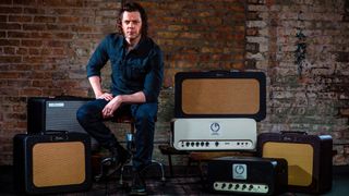 Brian Carstens poses with his guitar amp builds