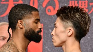 WBC and WBO super bantamweight champion Stephen Fulton (L) of the US and Japanese challenger Naoya Inoue face off during the official weigh-in at a hotel in Yokohama, Kanagawa prefecture on July 24, 2023, ahead of their title match at Tokyo's Ariake Arena on July 2