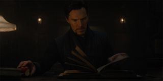 Doctor Strange (Benedict Cumberbatch) reads a spell book in Doctor Strange