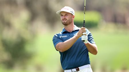 Wyndham Clark hits an iron shot at The Players Championship