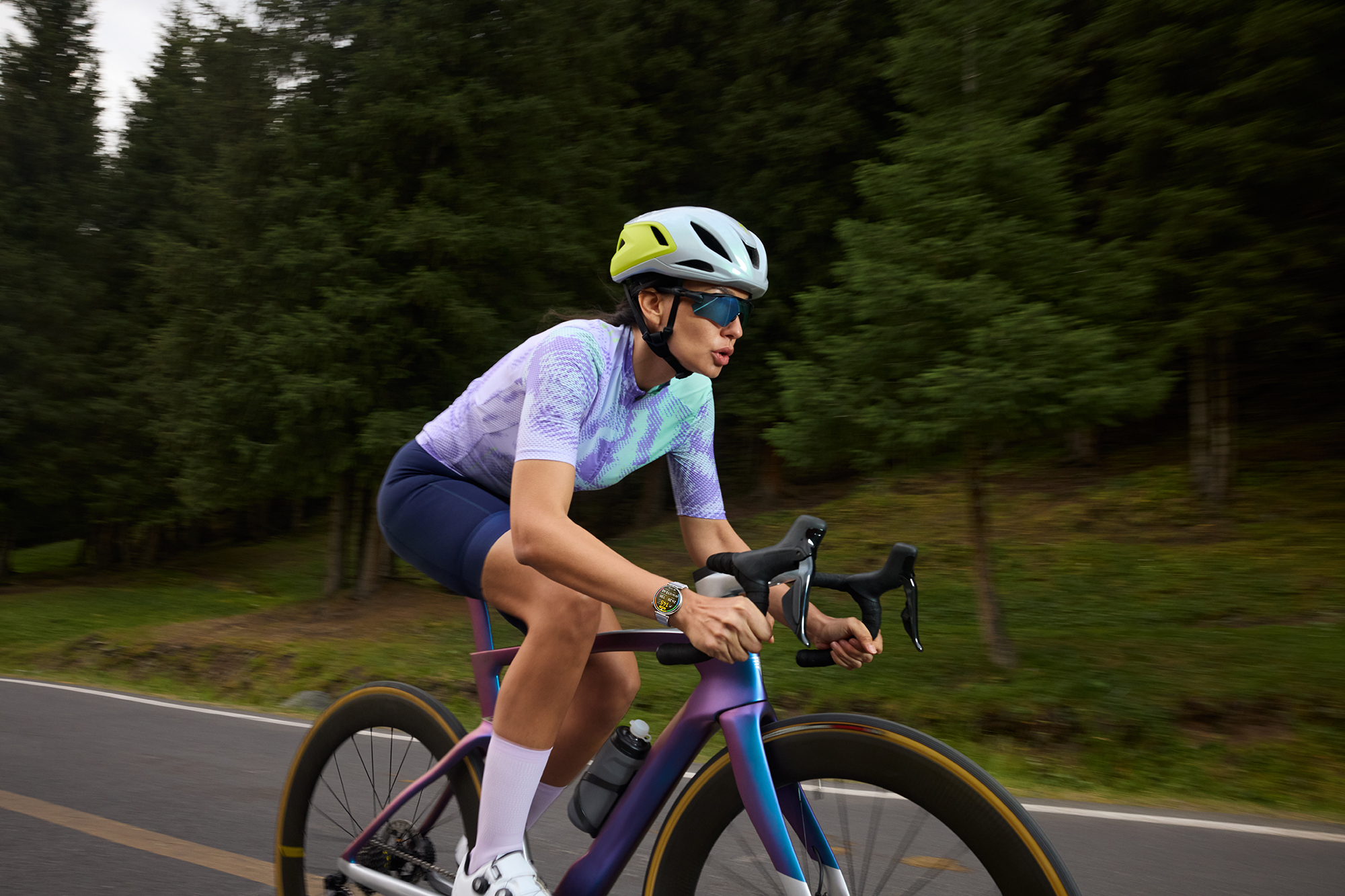 Female road cyclist wearing a Huawei Watch GT 6