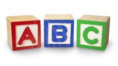 Three wooden blocks with ABC on them in red, blue and green.