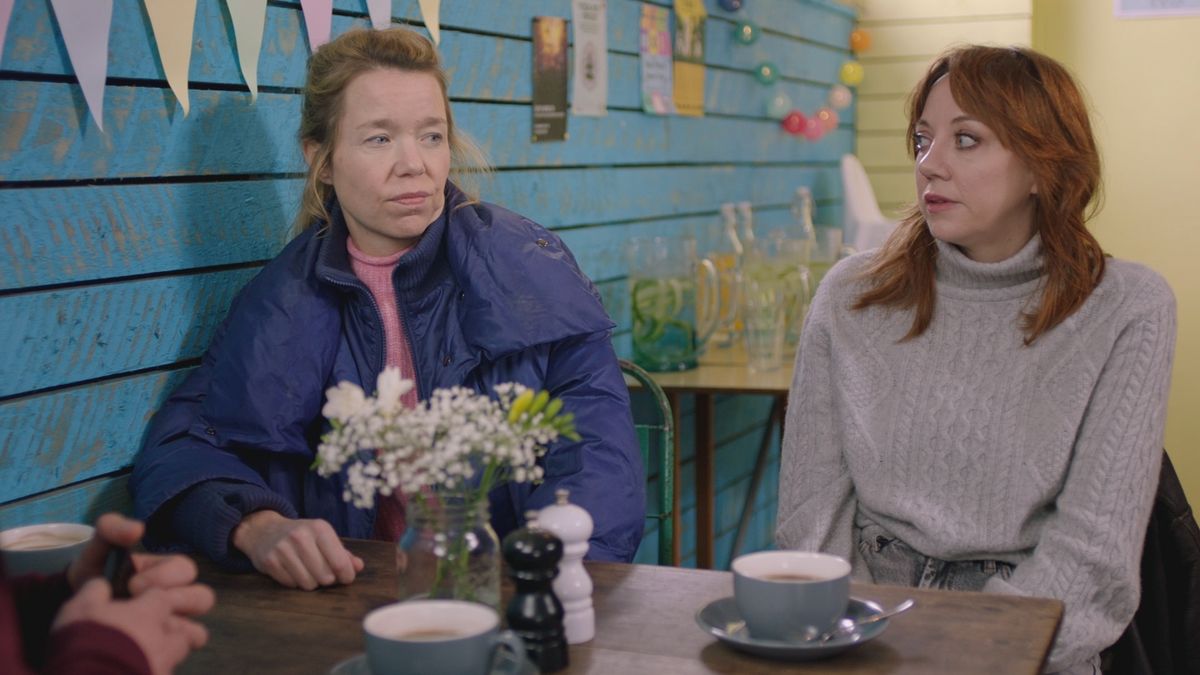 Julia (Anna Maxwell-Martin) and Liz (Diane Morgan) sitting down in a cafe in Motherland