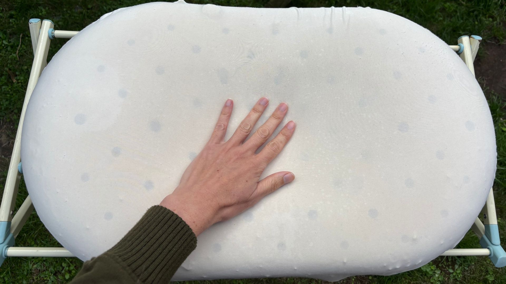 The image shows a memory foam pillow drying in the sunshine after yellow stain removal treatment