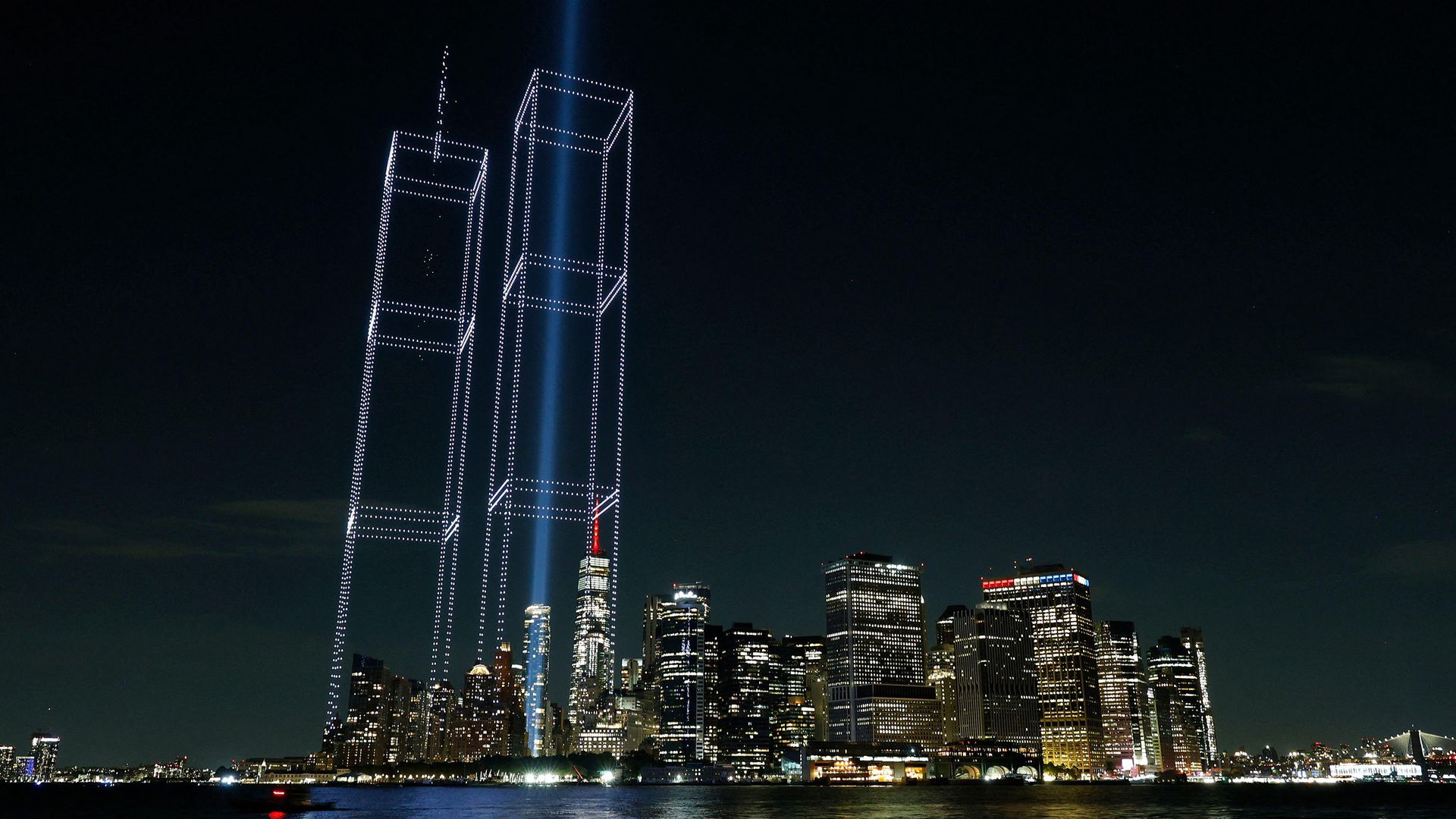 3FFTHE6 A light installation in the shape of the Twin Towers is illuminated with drones over One World Trade Center and the Manhattan skyline in the days leadin
