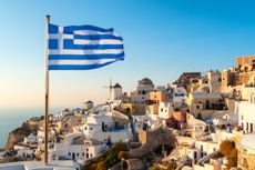 Oia Sunset and Greek Flag, Santorini, Greece