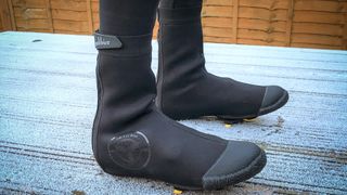 Galibier arctic overshoes on frost covered decking 