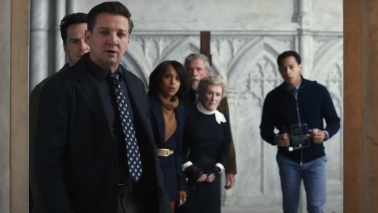 The cast looks into a room with shock and surprise in Wake Up Dead Man: a Knives Out mystery.