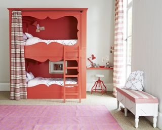 Kids' room paint ideas with white walls, cadmium red painted bunk bed and red furnishings.