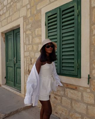 French girl's holiday wardrobe: @aidabadji_ wears white linen shirt with white shorts