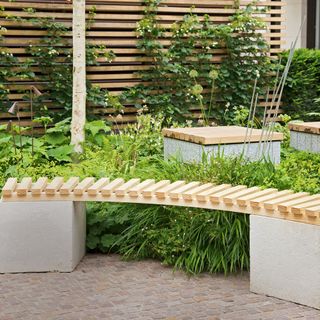 garden area with bench and plants